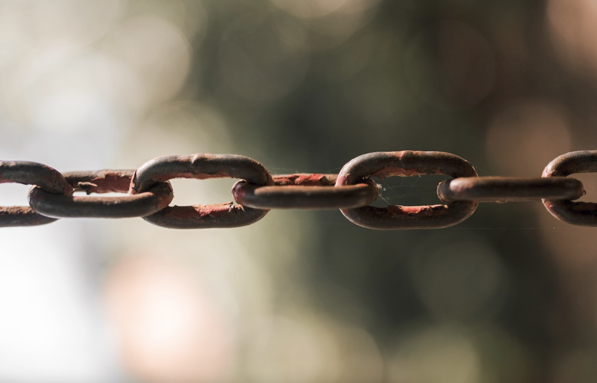 decorative image of a thick rusty chain with links